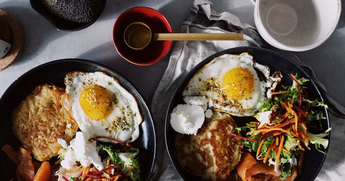 A plate of vitamin B12-rich foods including salmon, eggs, and cheese