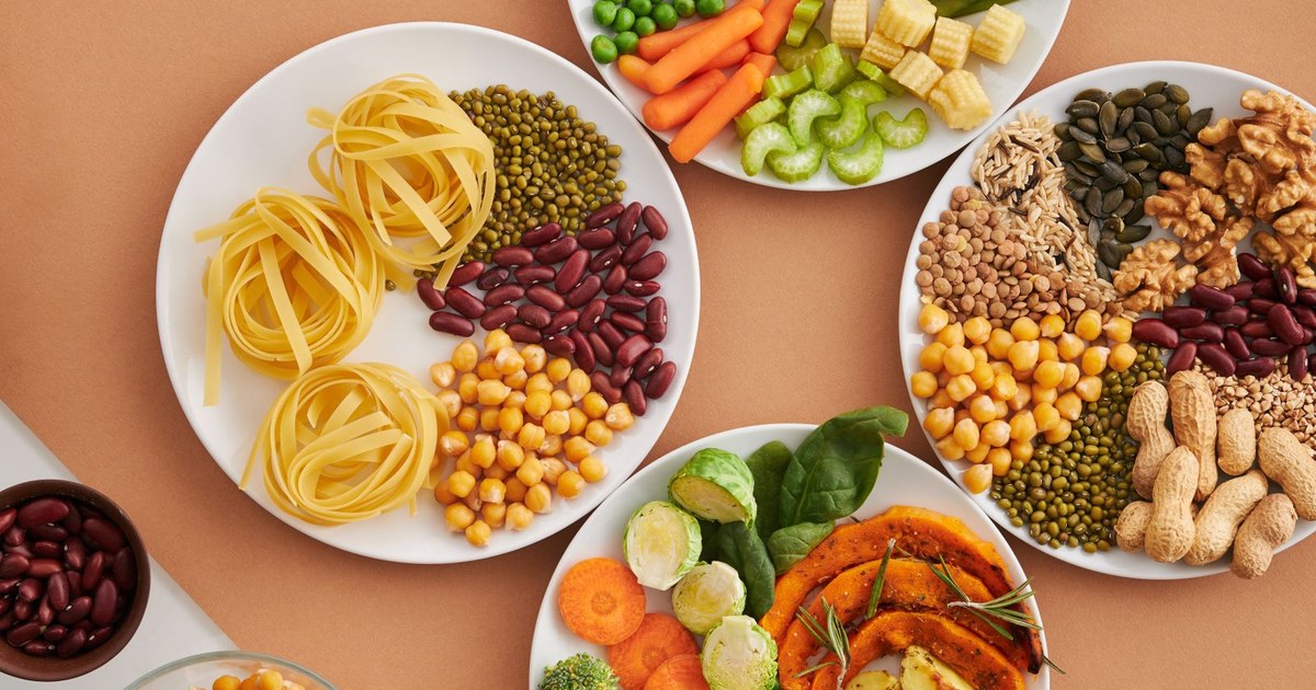 A spread of iron-rich plant foods including beans, lentils, and seeds