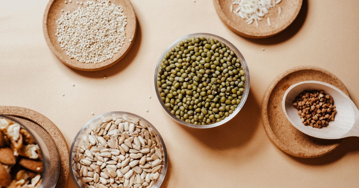 An overhead flat-lay of seeds, nuts, and legumes, foods naturally rich in zinc