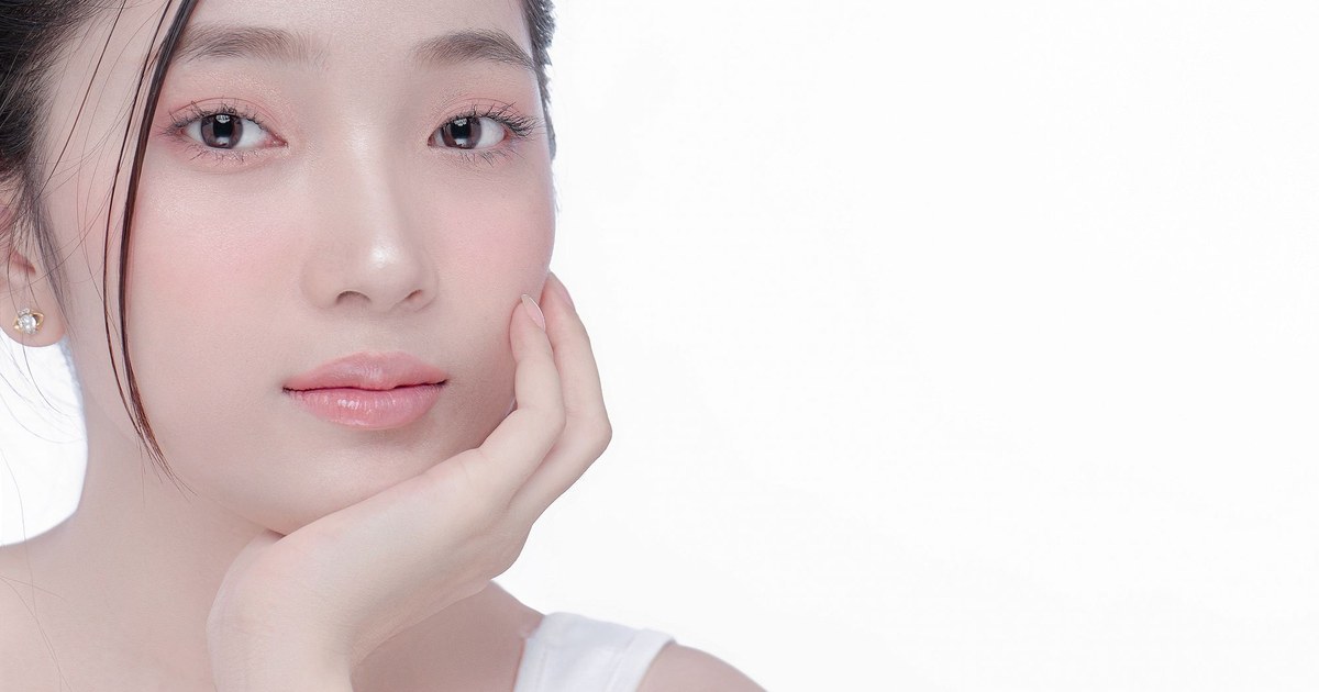 A young woman with clear, radiant skin